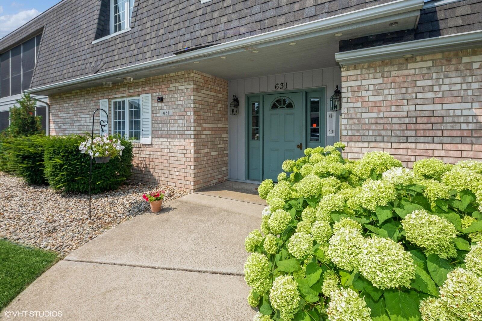 a front view of a house with garden