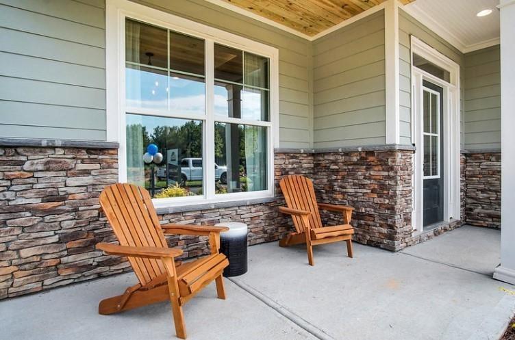 a view of a patio with a table and chairs