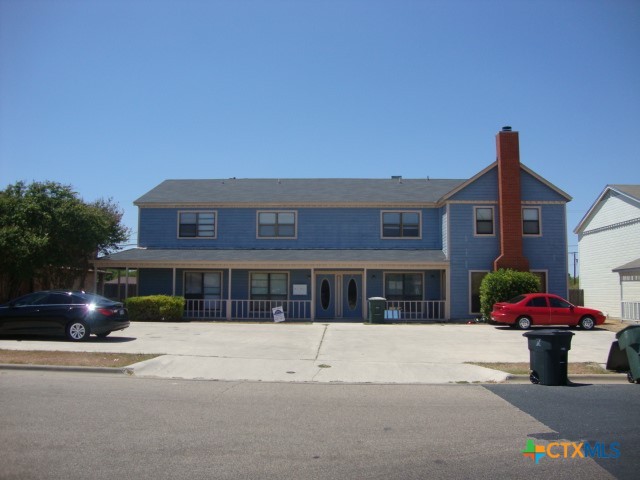 a front view of a building with street view