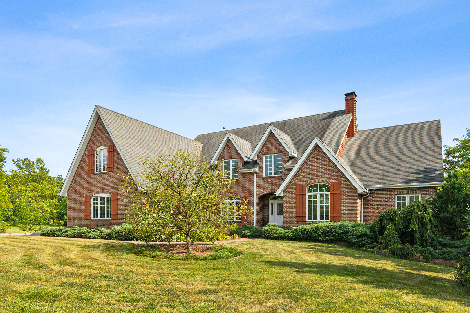 a front view of a house with a yard