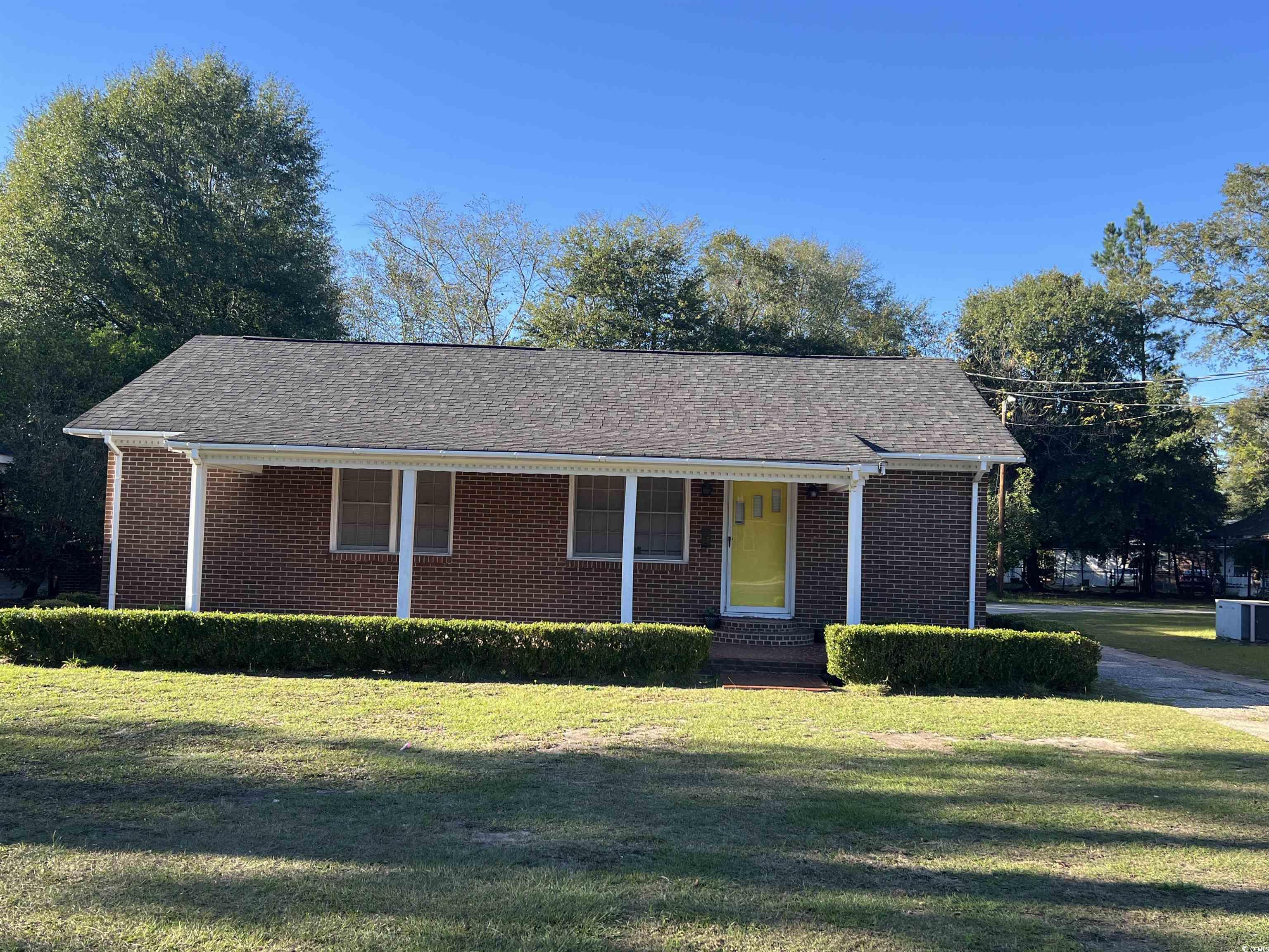 Ranch-style home with a front yard