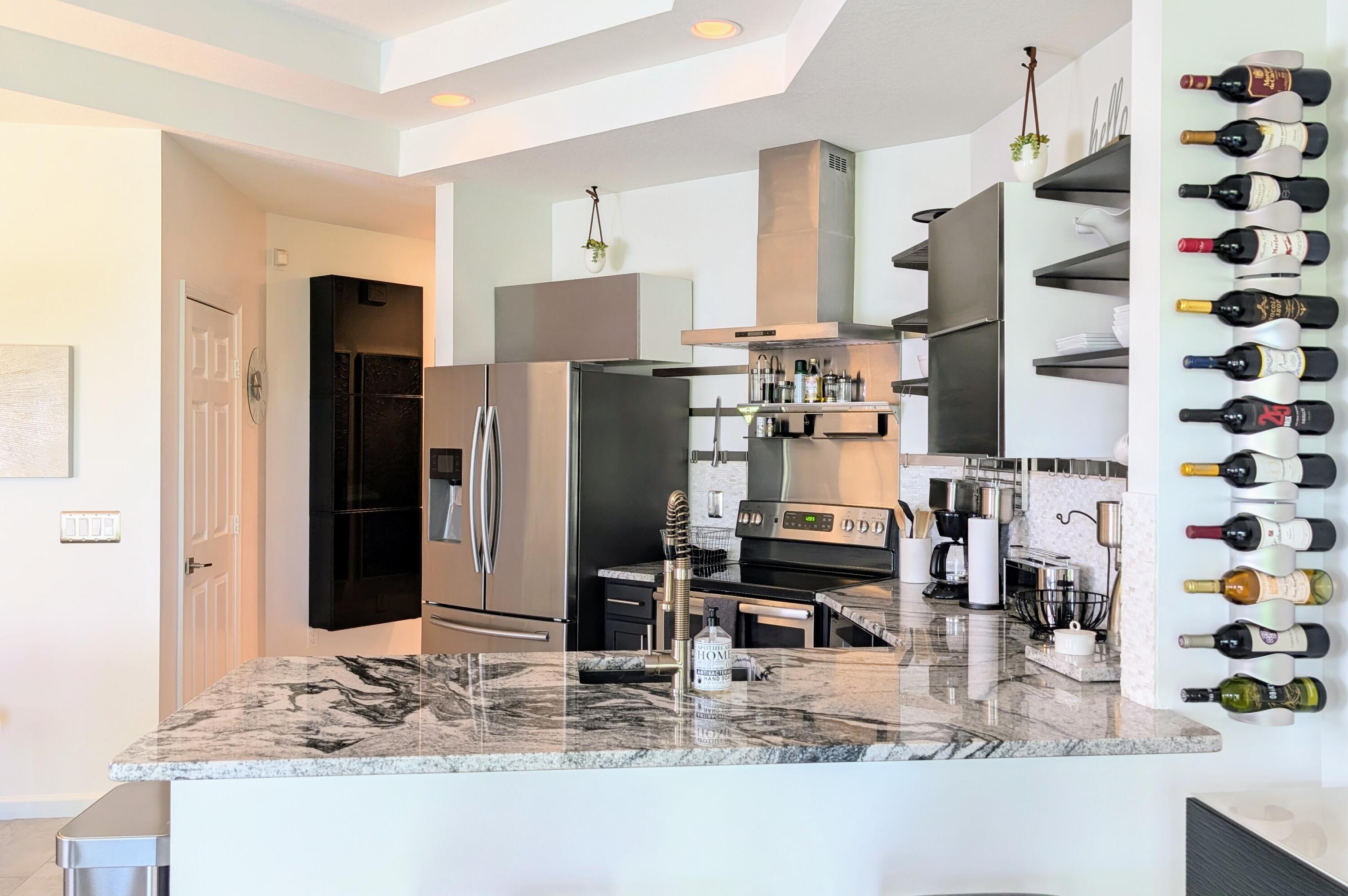 a kitchen with refrigerator and sink