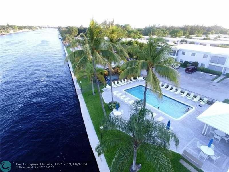 a view of a swimming pool with a lake view