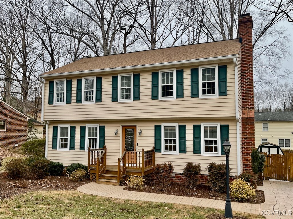 a front view of a house with yard and outdoor seating