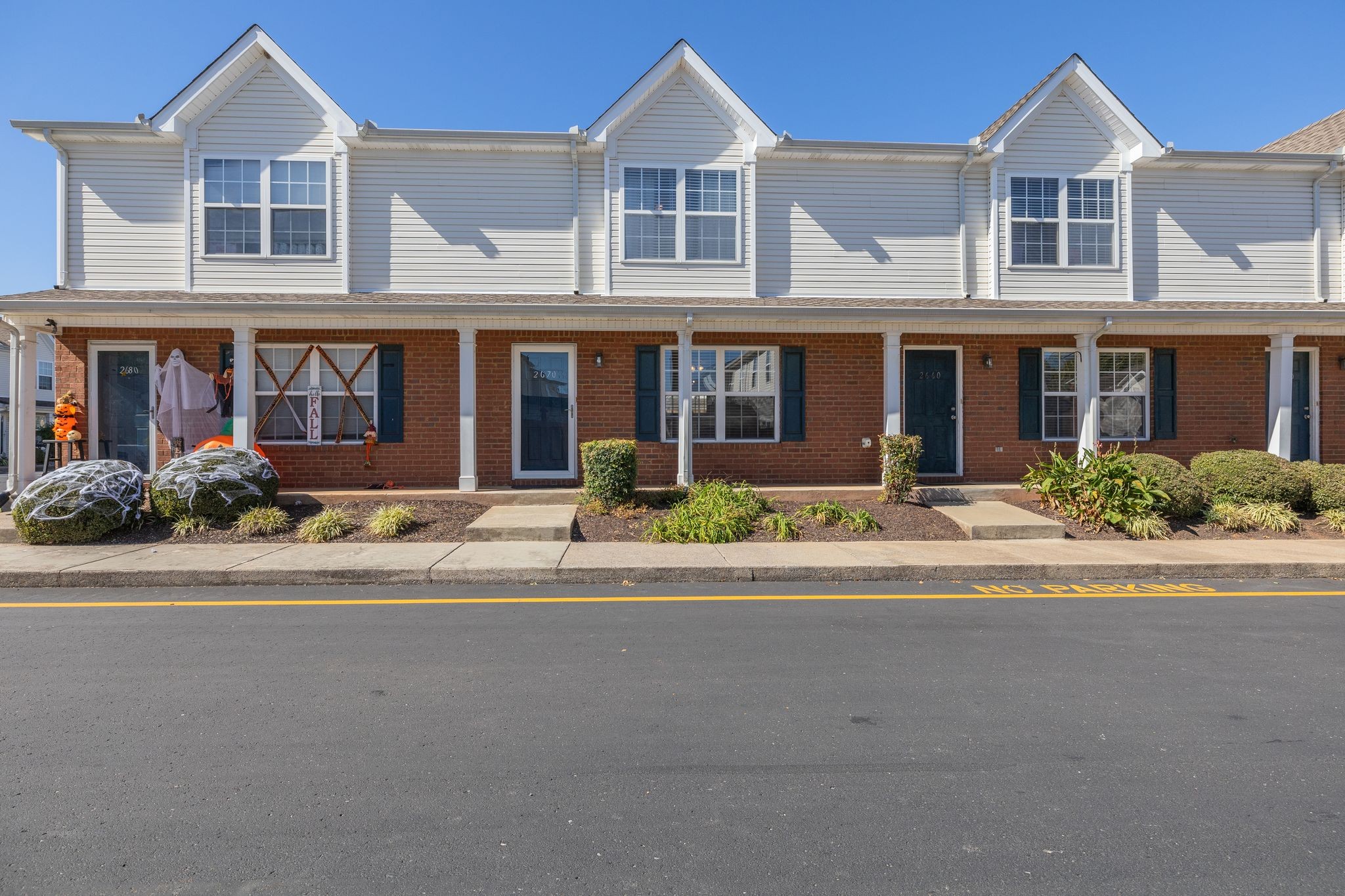 front view of a house with a yard