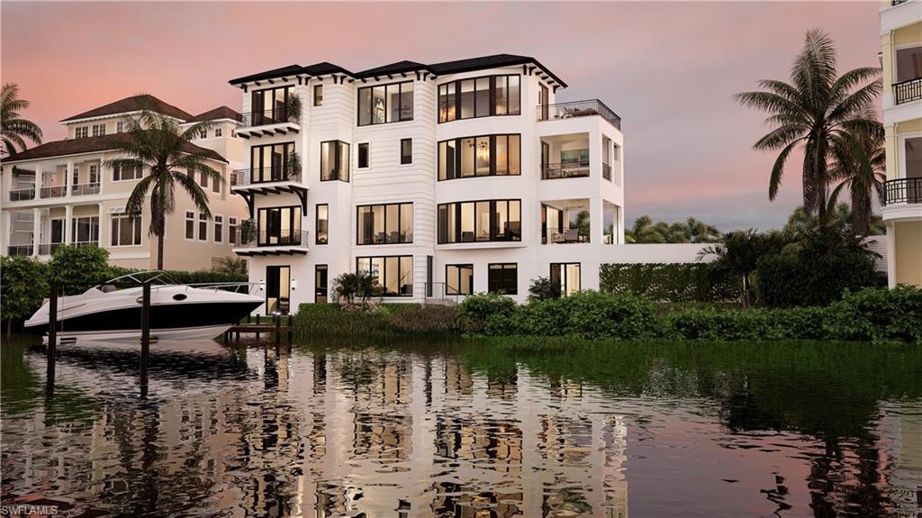 a front view of a house with a lake view