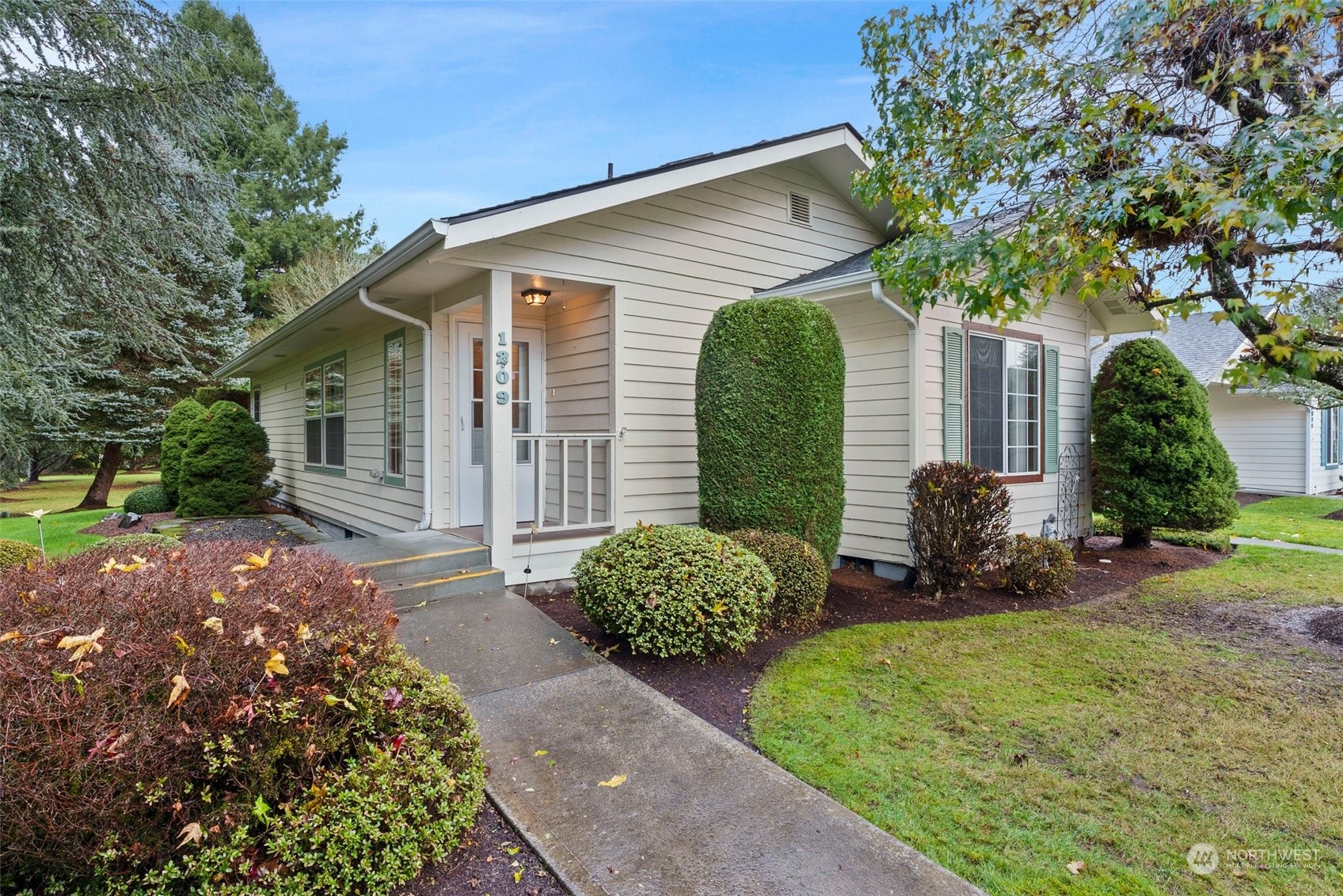 a front view of a house with garden