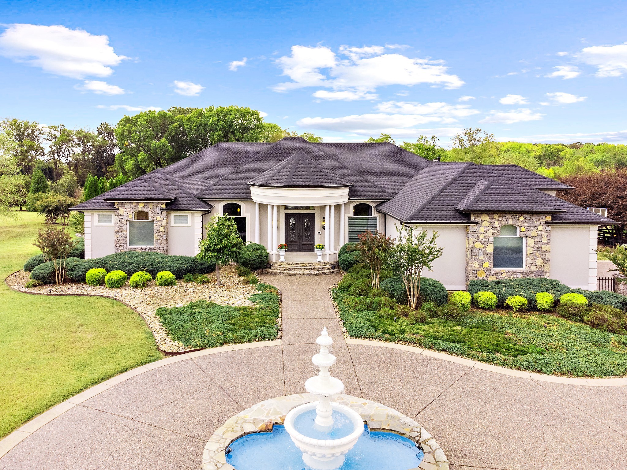 a front view of a house with a yard