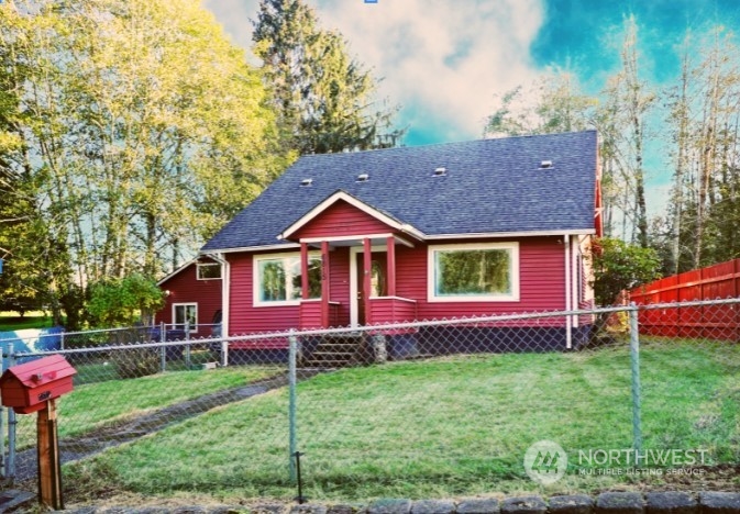 a front view of a house with a garden