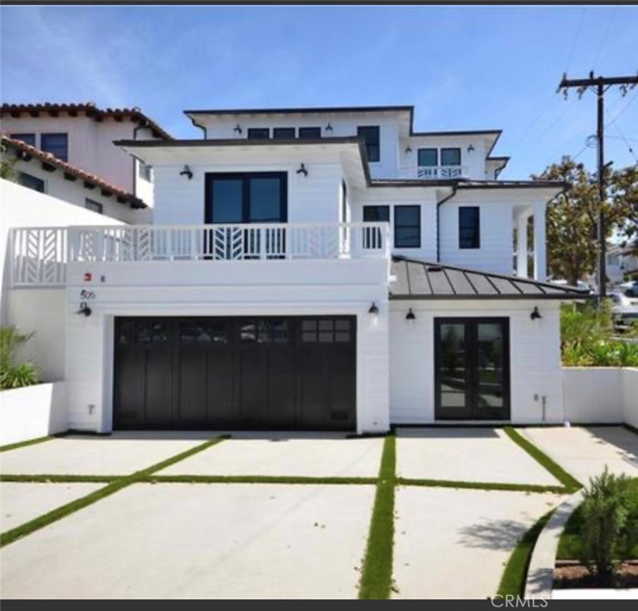 a front view of a house with a garage