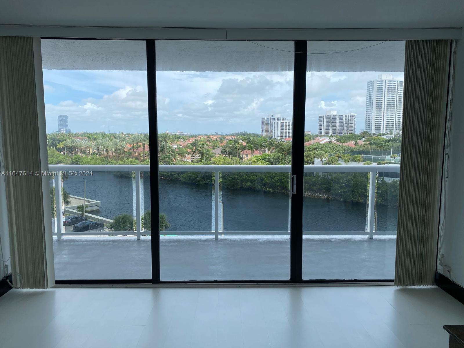 a view of a glass door and a window