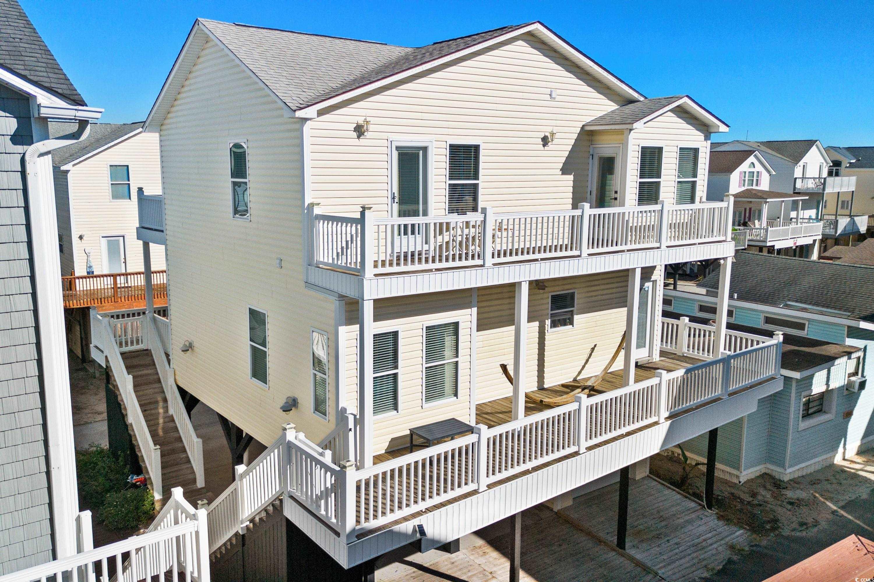 Rear view of property with a balcony