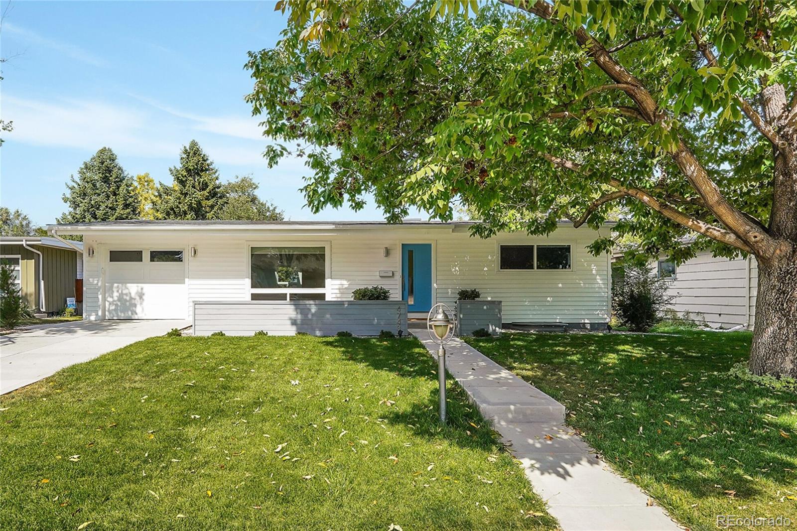 a front view of house with yard and seating area