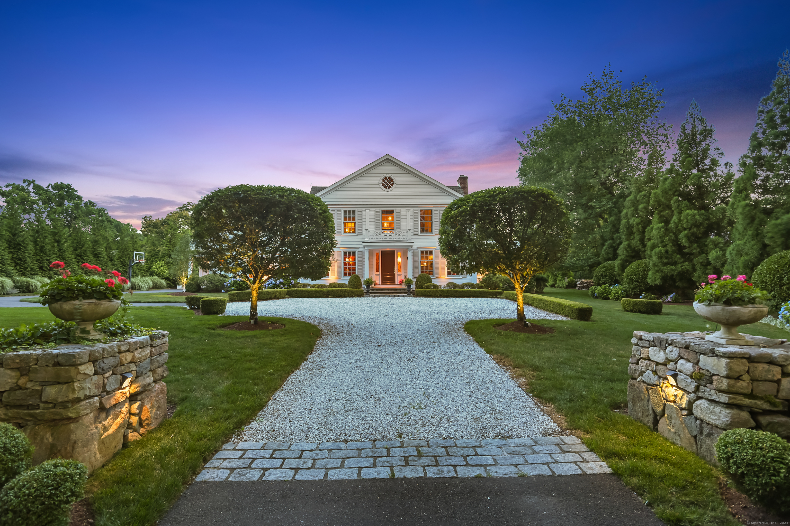 Stunning Georgian Colonial, professionally landscaped and lit.