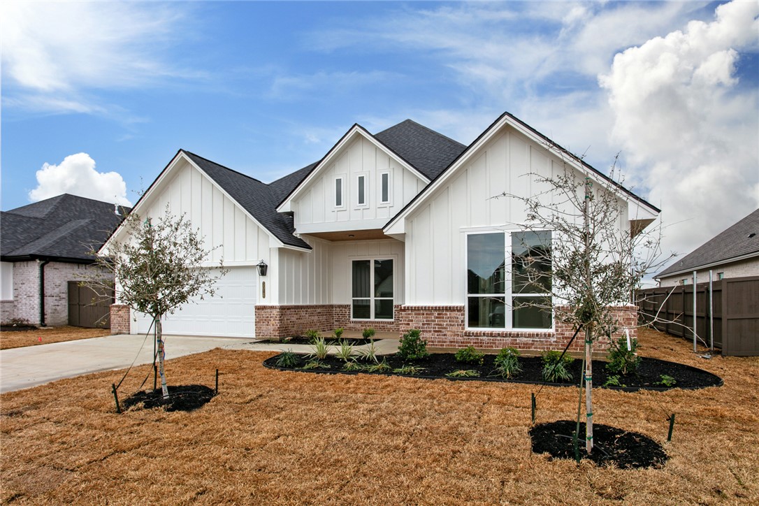 Modern inspired farmhouse featuring a garage