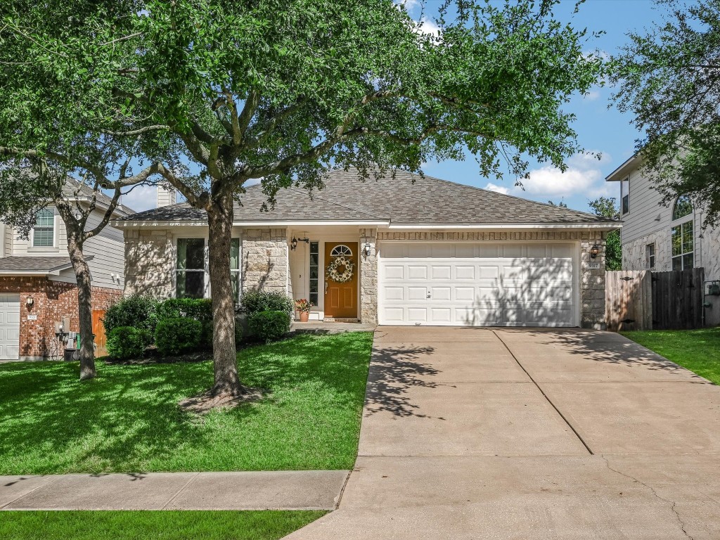 a front view of a house with garden