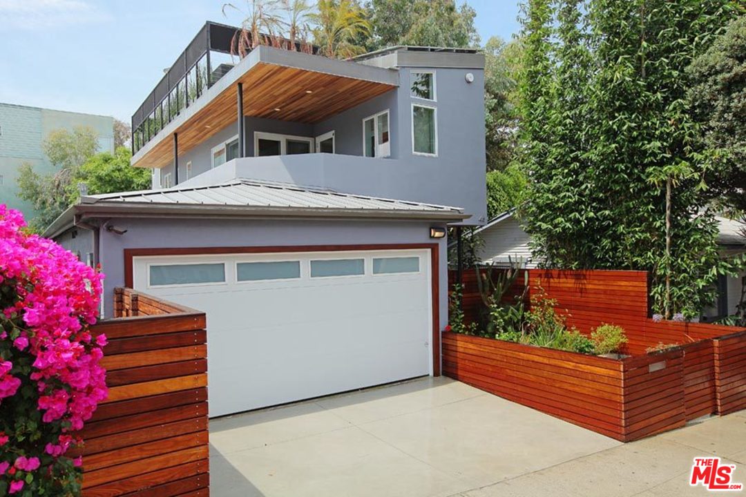 a front view of a house with a garage