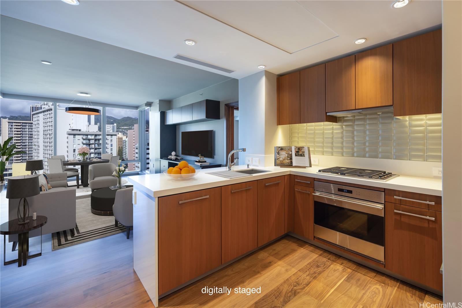 a kitchen with granite countertop a sink cabinets and stainless steel appliances