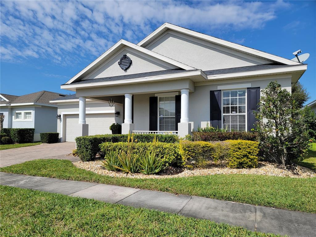 a front view of a house with garden