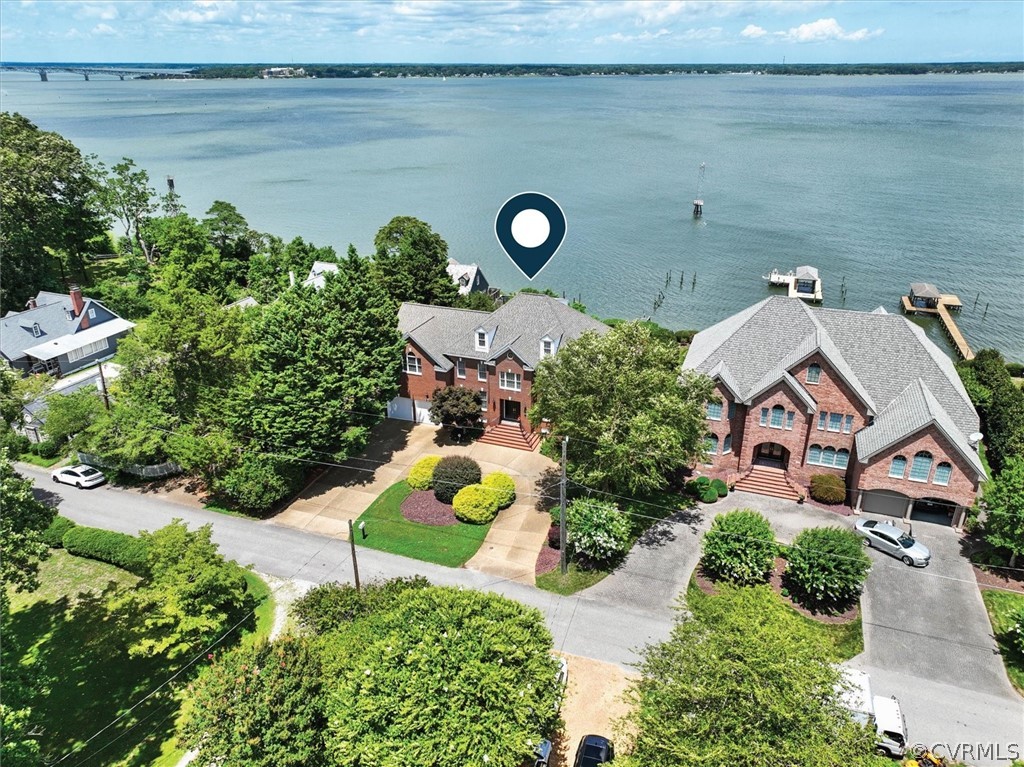 an aerial view of a house with yard