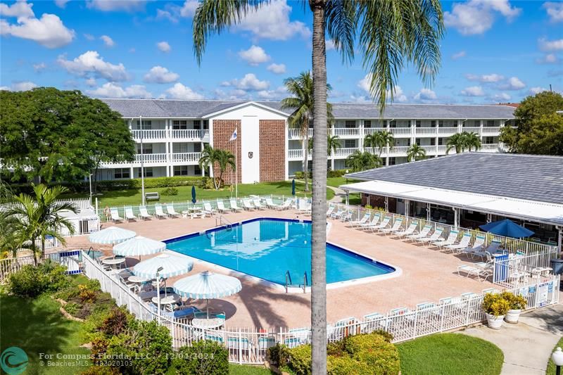 a view of a swimming pool with a patio