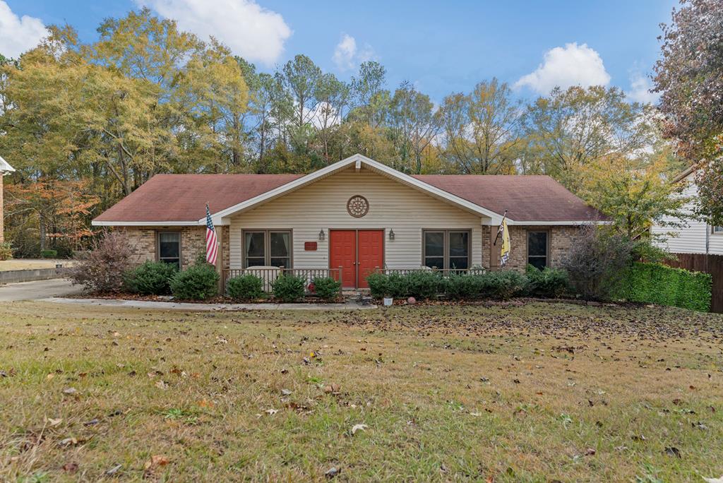 a front view of a house with a yard