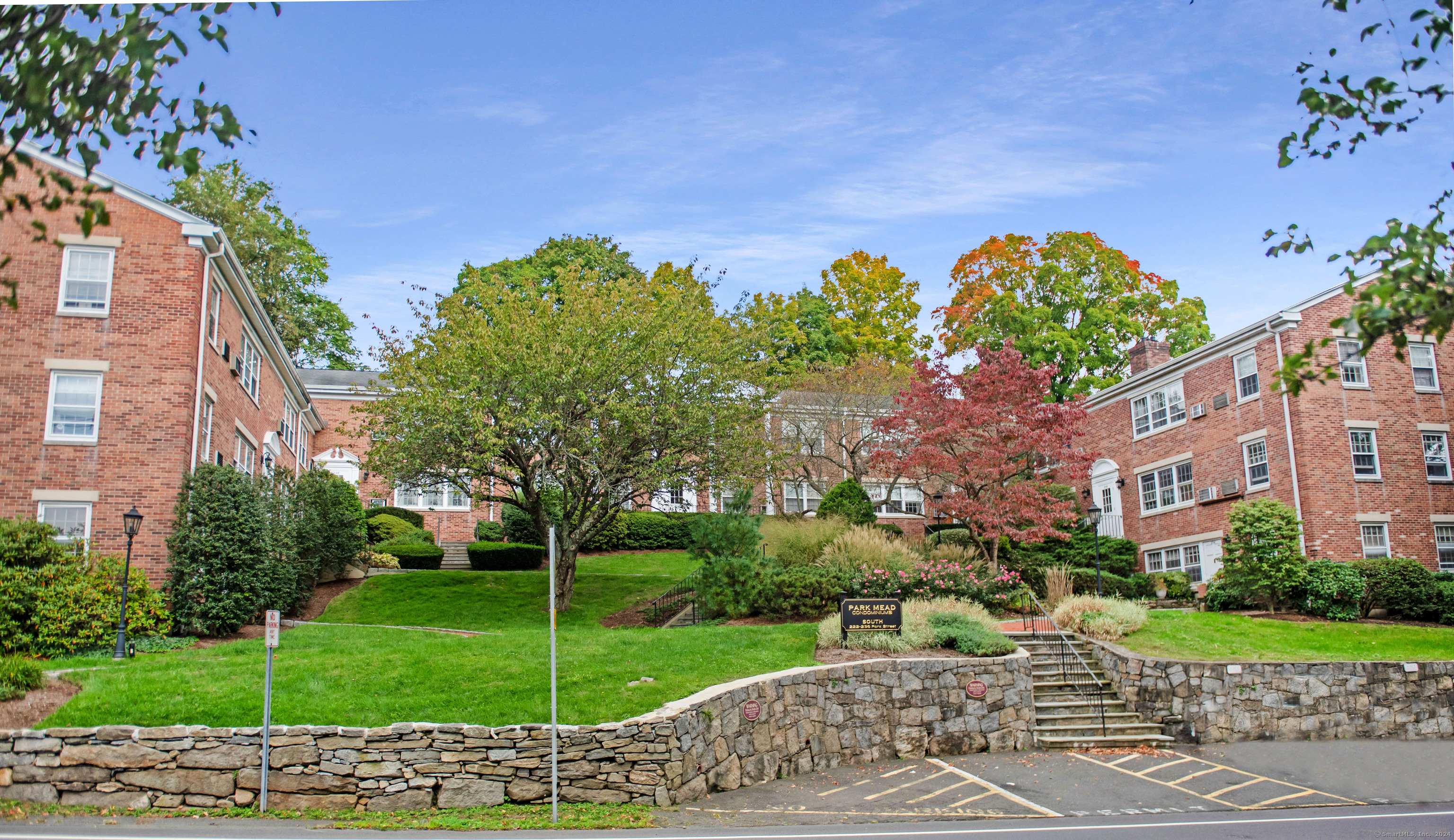 a view of a garden with a building in the background