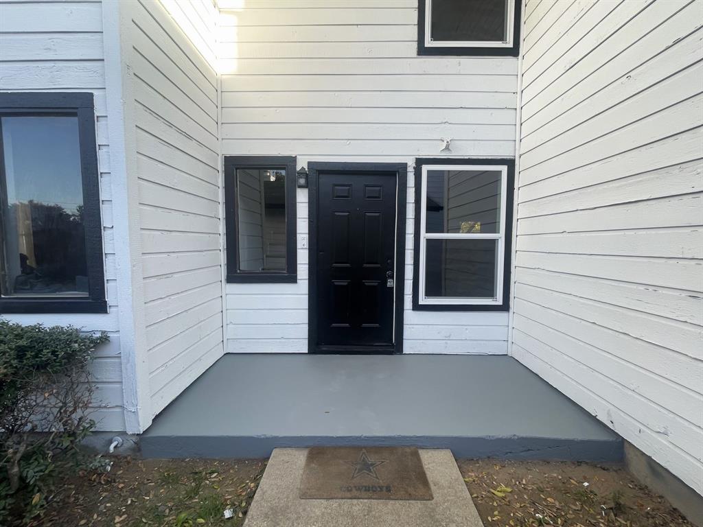 a view of a door and a window