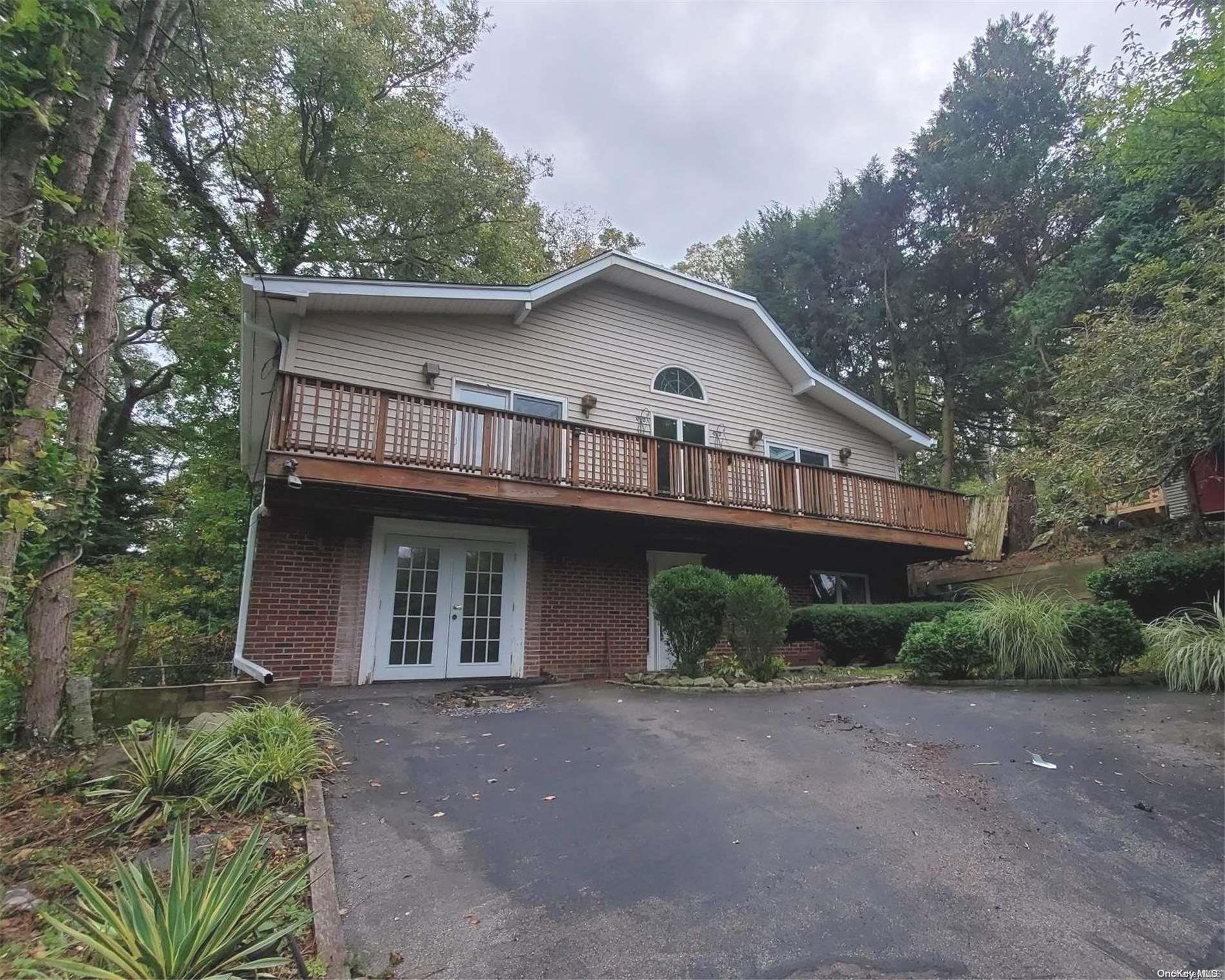 a view of a house with a yard and plants