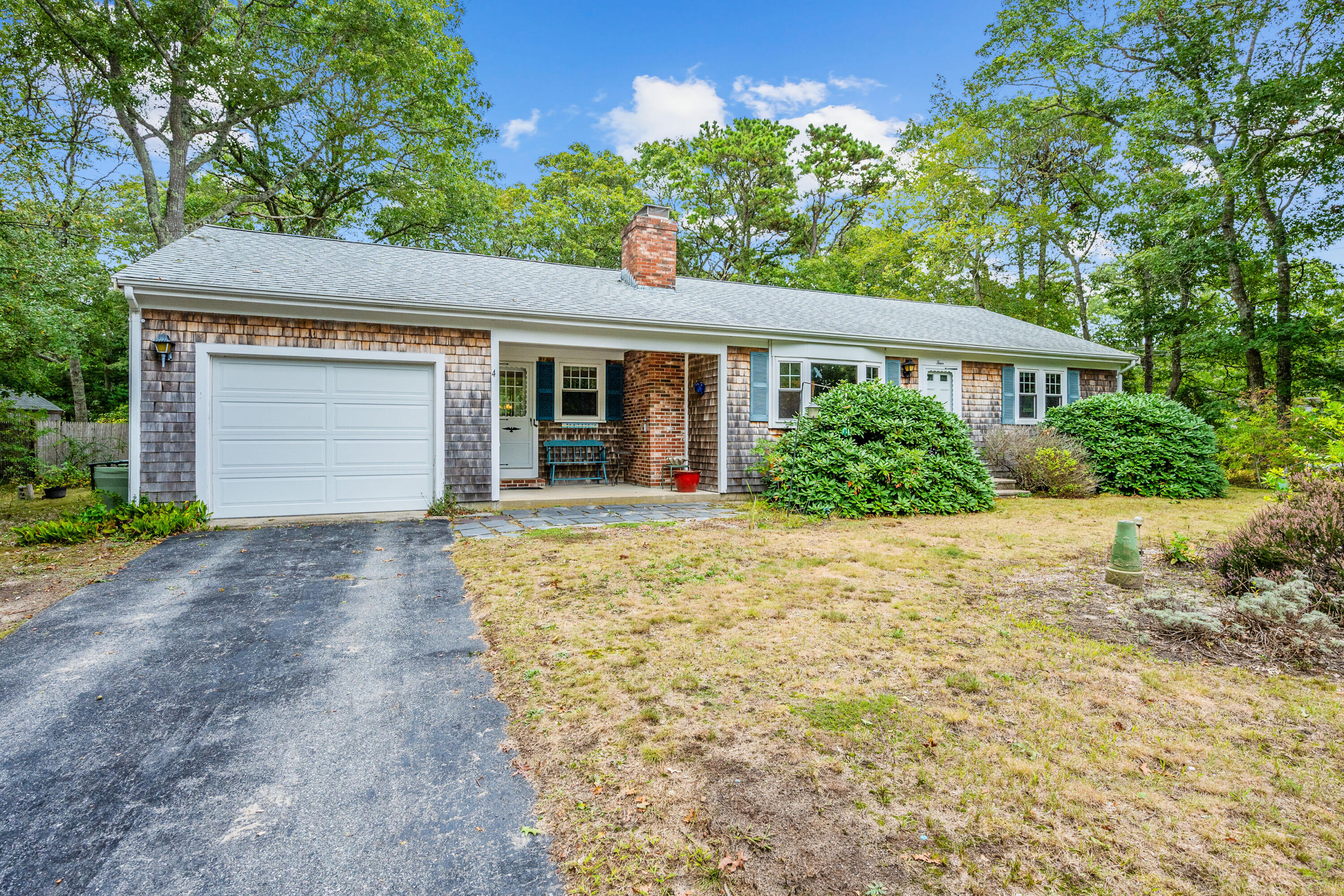 front view of a house with a yard