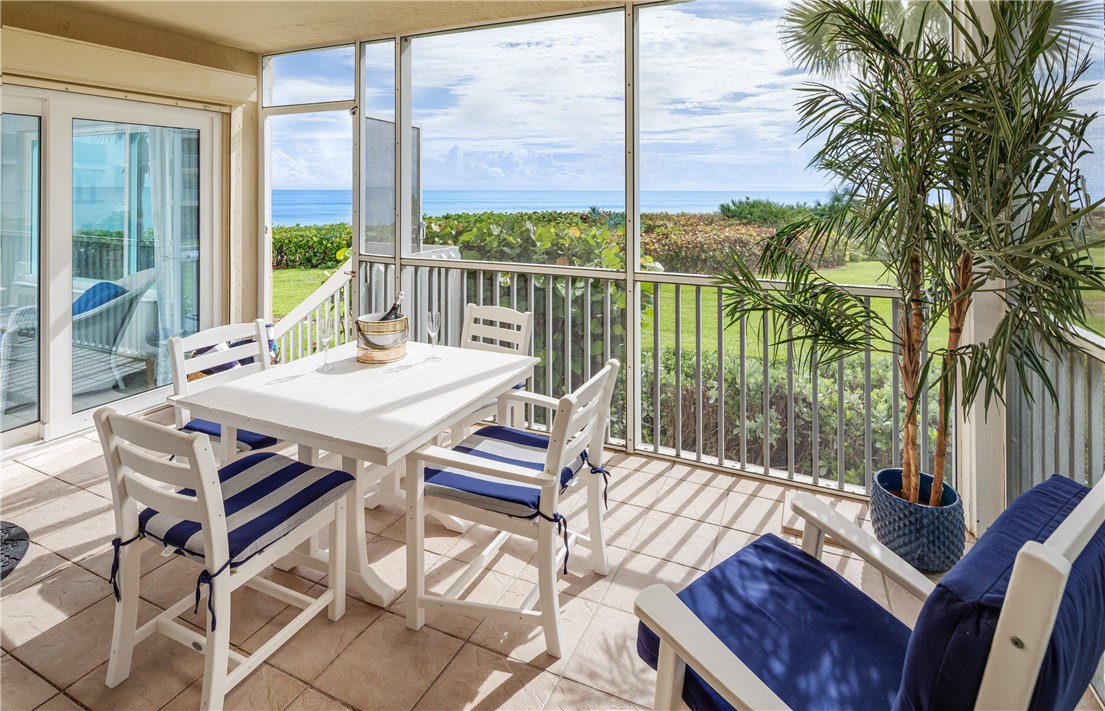 a view of a patio with a table chairs and a table