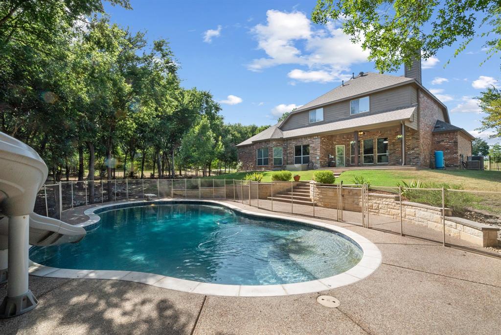 a view of a swimming pool with a patio