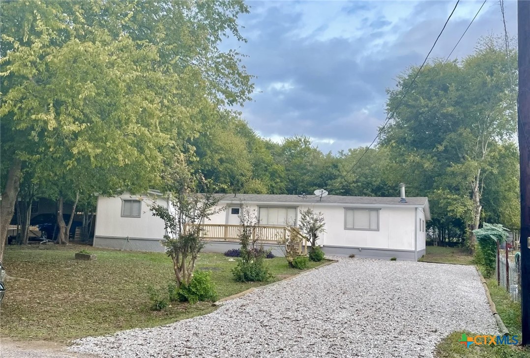 a front view of a house with a yard and a garage