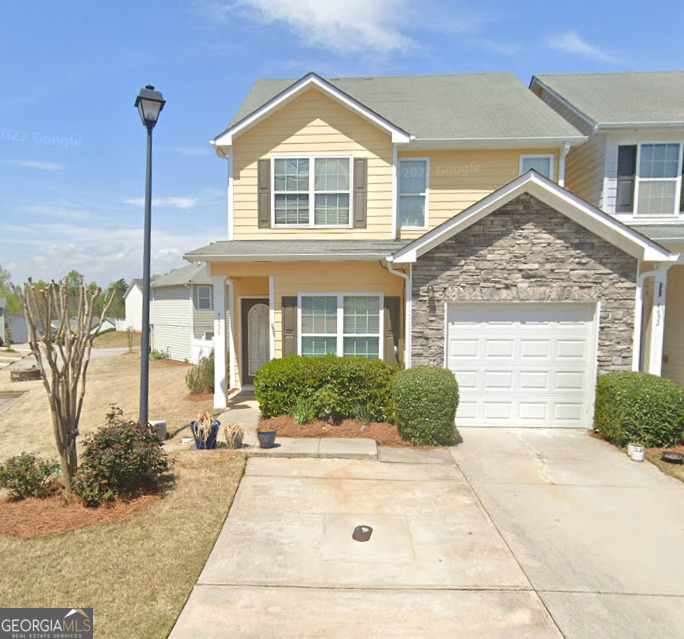 a front view of a house with a yard