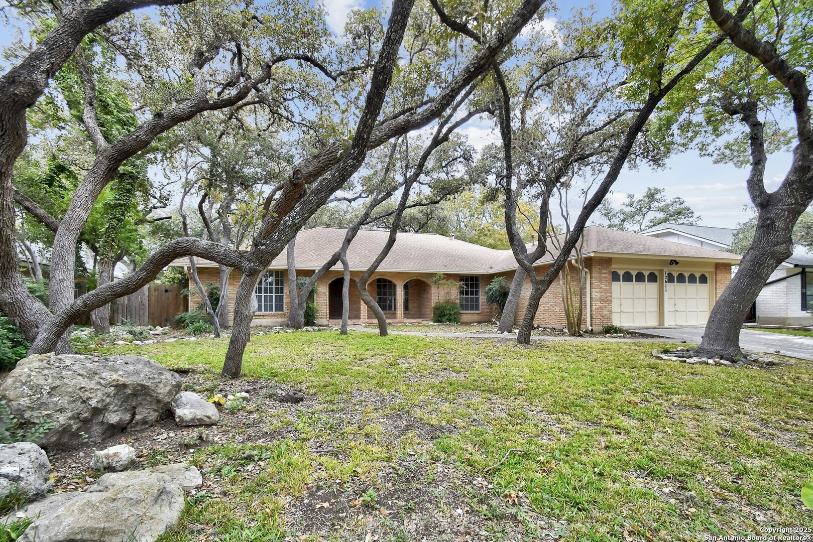 a house that has a tree in front of it