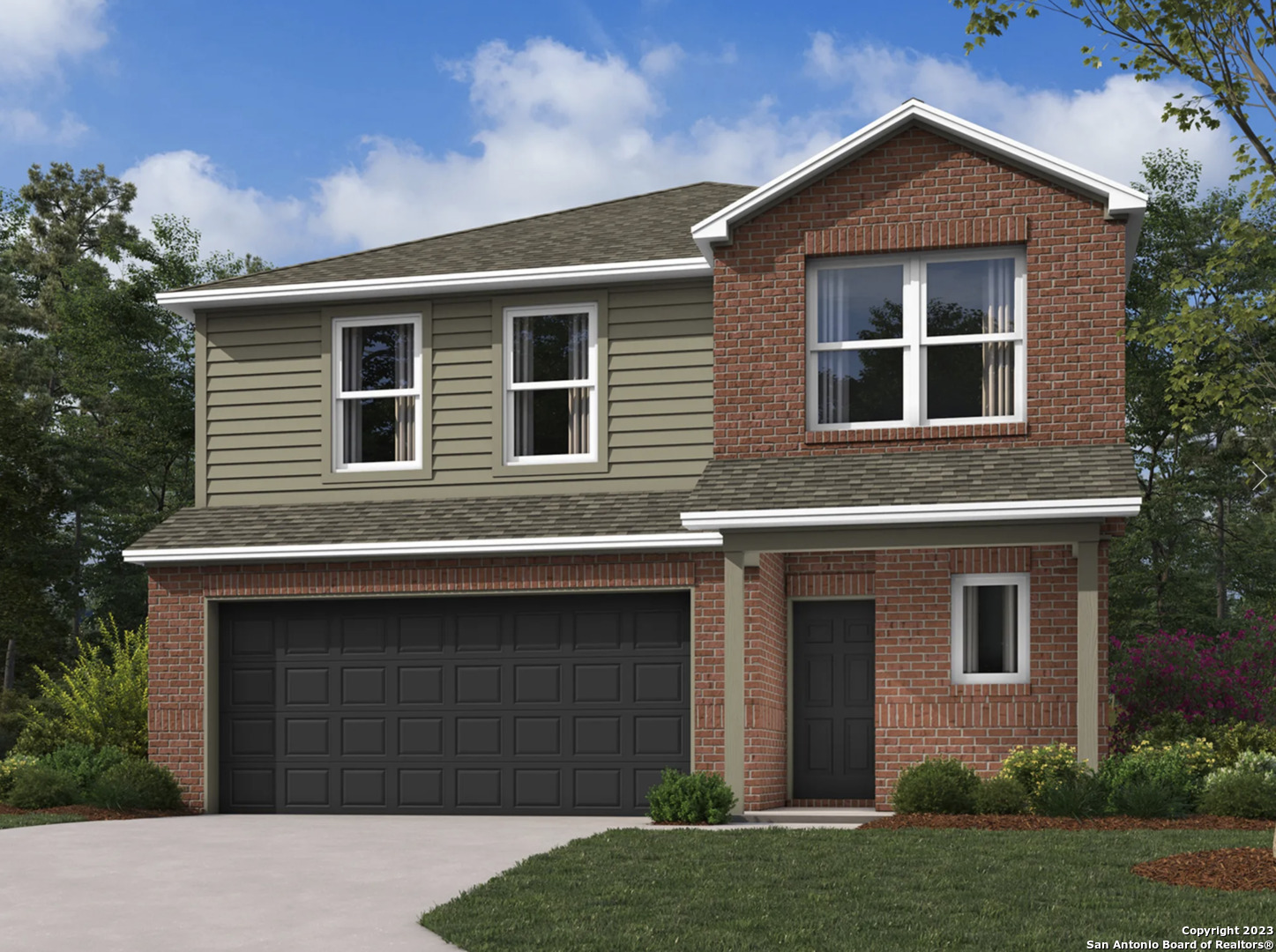 a front view of a house with a yard and garage