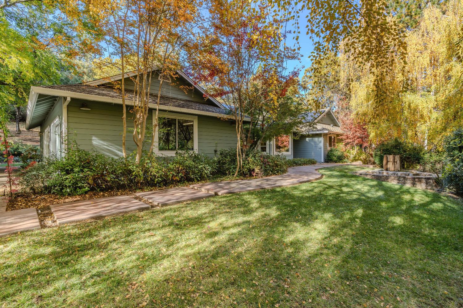 a front view of a house with garden