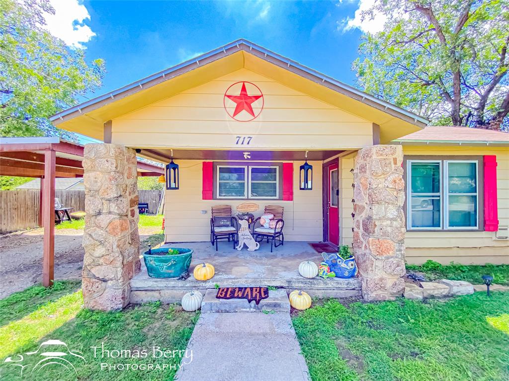 a front view of house with outdoor seating