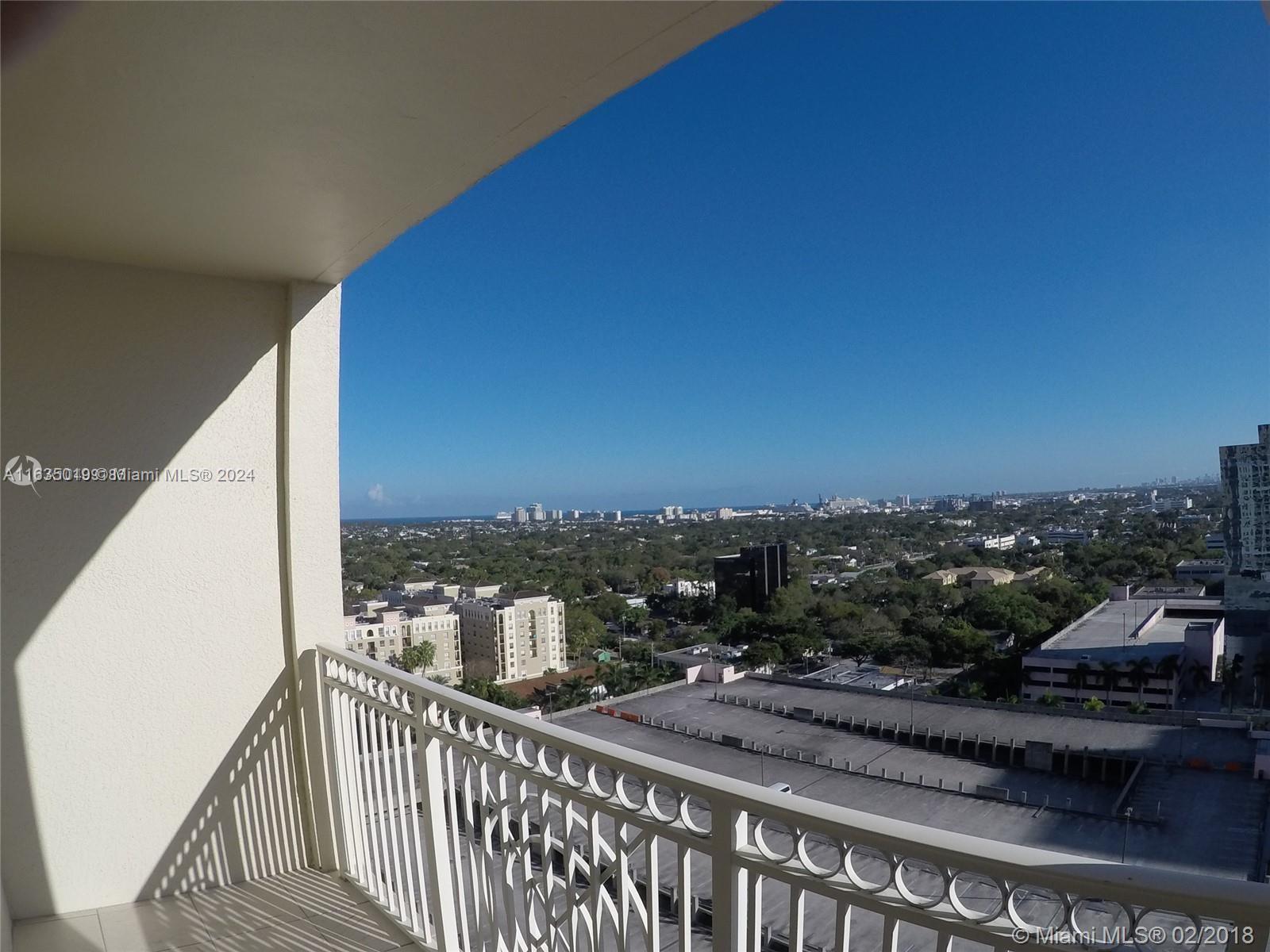 a view of a balcony with city view