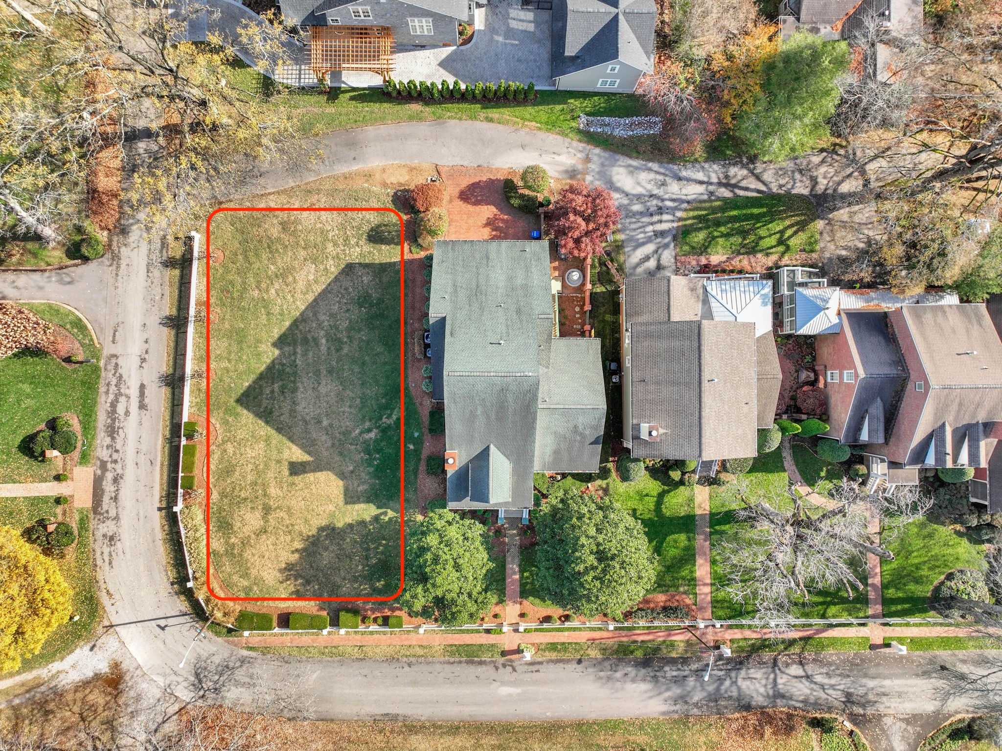 an aerial view of a house with a lake view