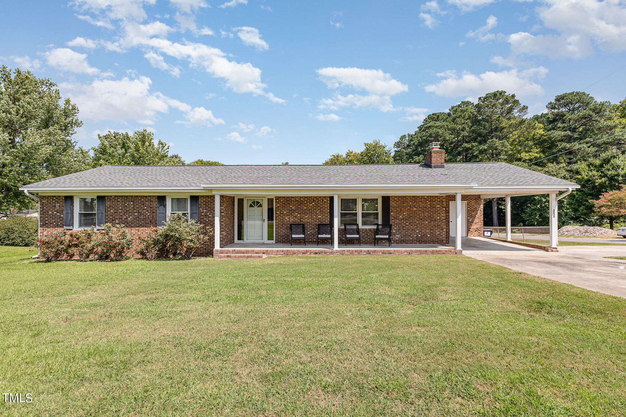 front view of a house with a garden