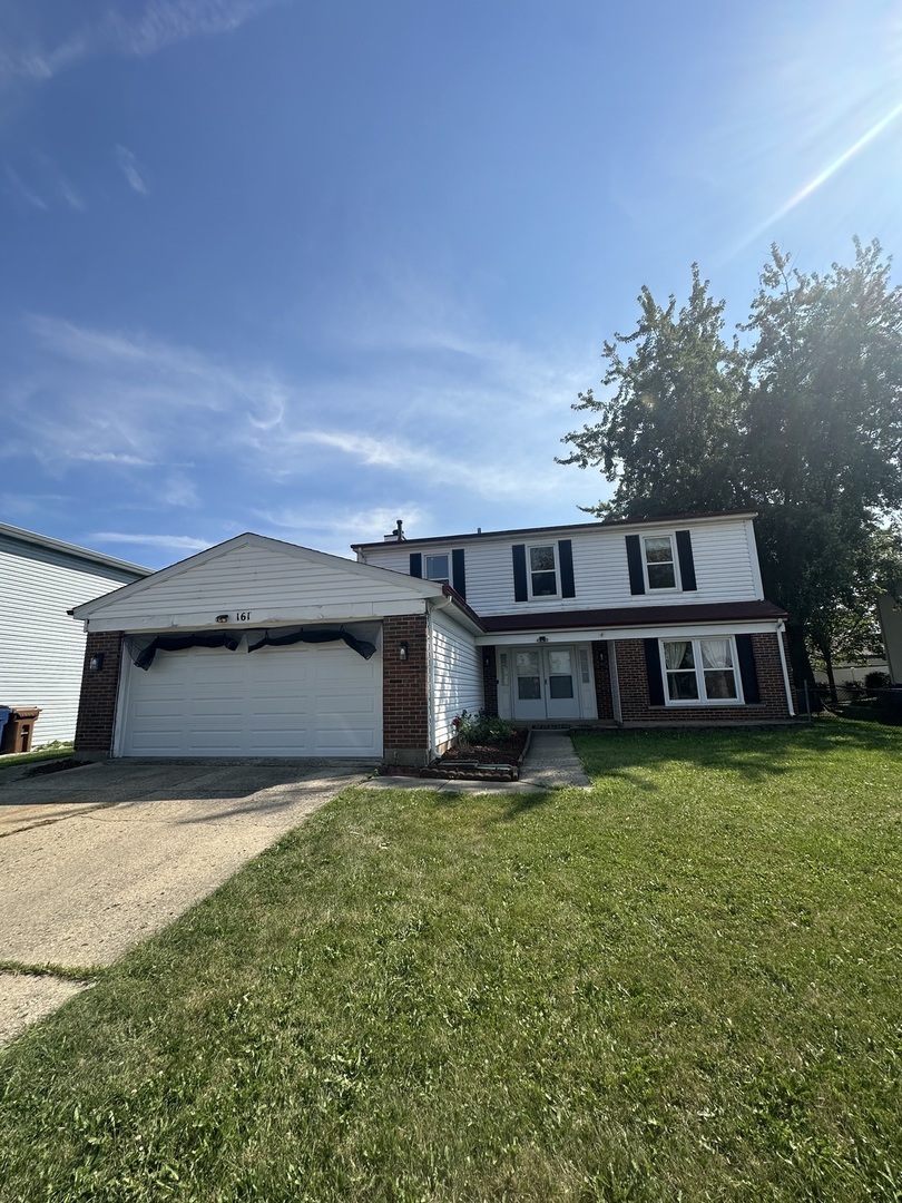 front view of a house with yard