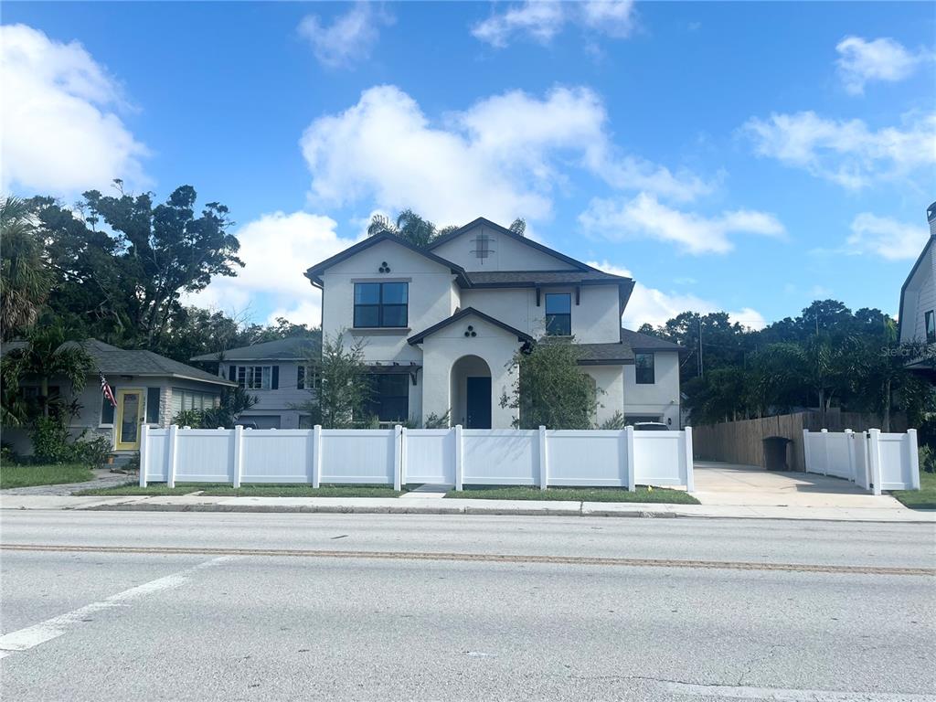 a view of a house with a yard