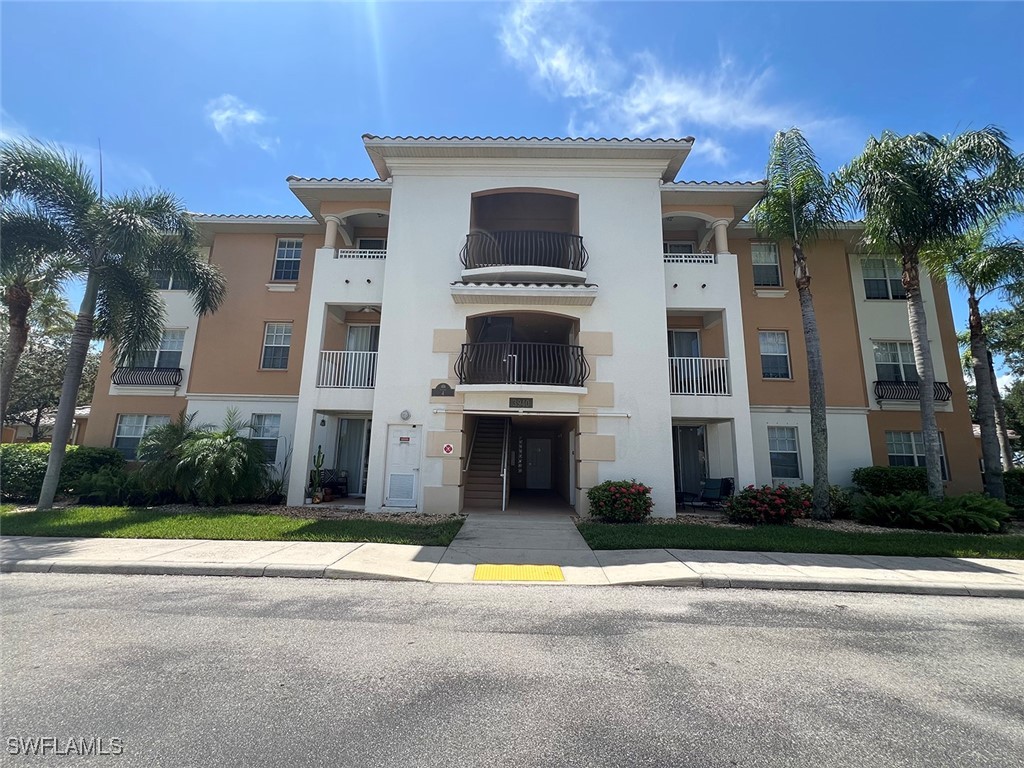 a front view of building with yard