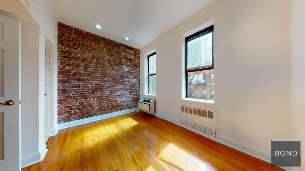 a view of an empty room with windows