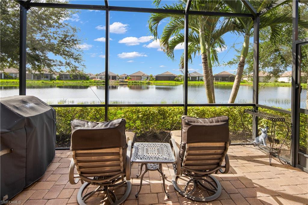 a view of a chairs and table in patio