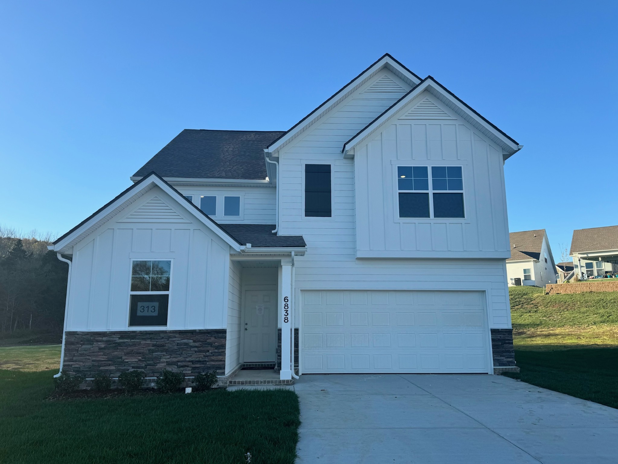 front view of a house with a yard