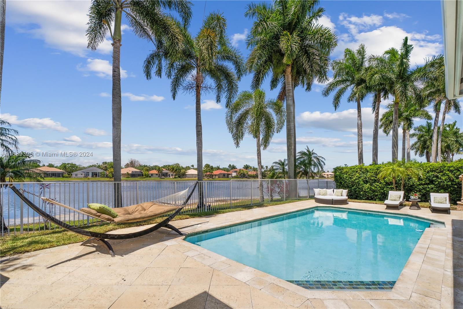 a view of a swimming pool with a lounge chair