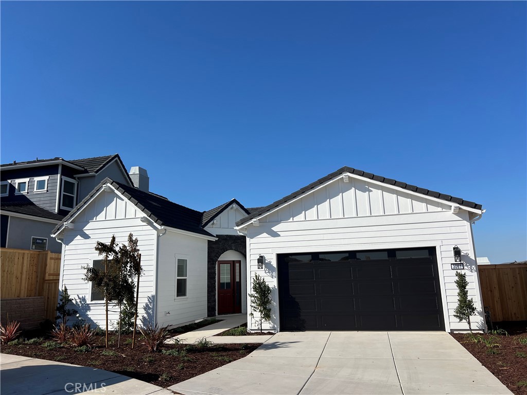 a front view of a house with a garage