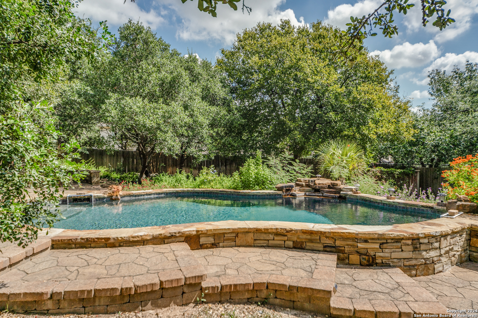 a garden view with a seating space